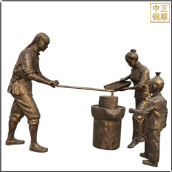 推石磨人物銅雕塑